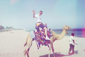 Shawn rides a camel